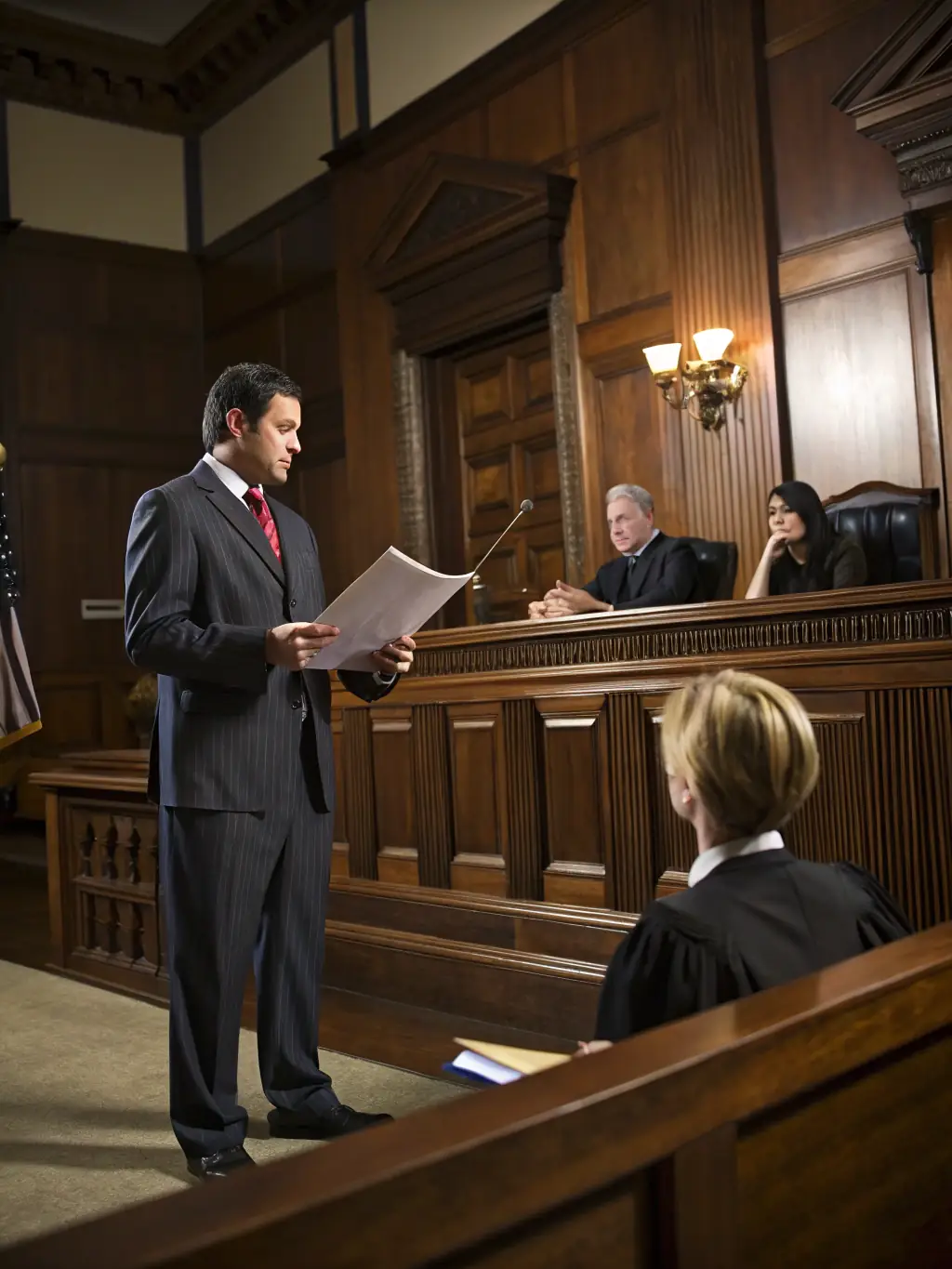 An image of a lawyer representing a client in a courtroom setting, emphasizing advocacy and legal representation.